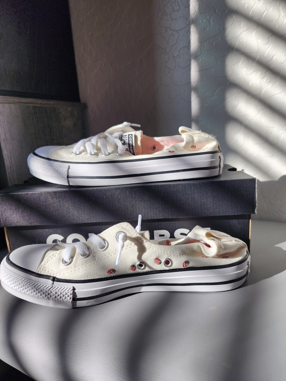 Converse Low Top Slip-On Sneakers in Cream with Strawberry Accents